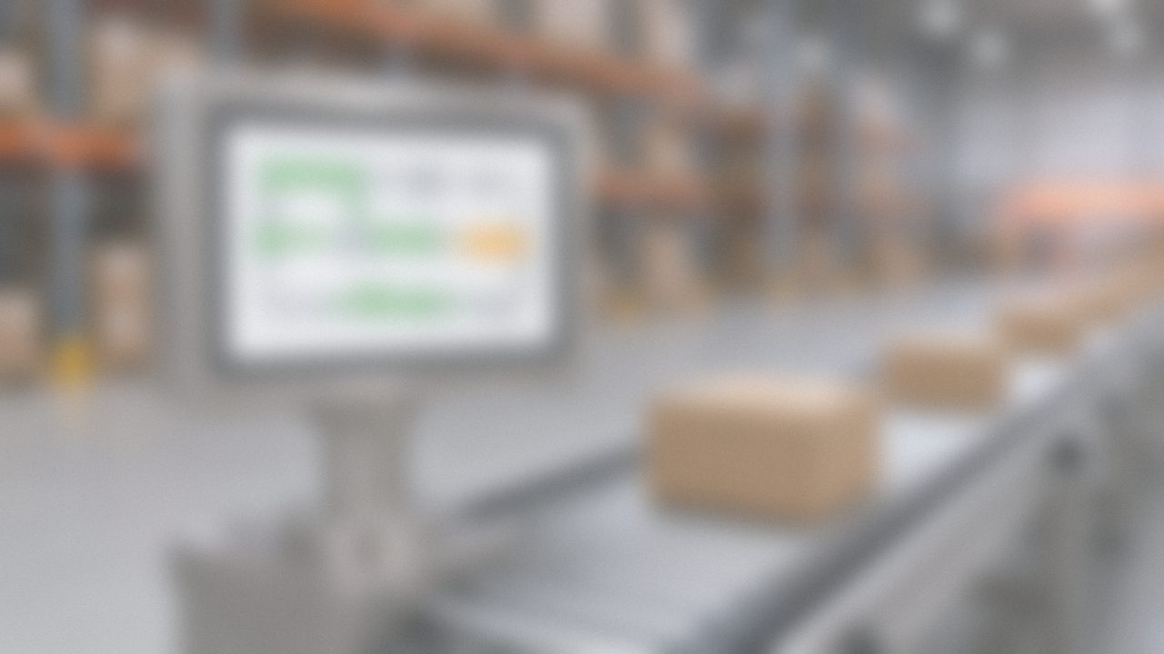 Operator HMI on a pedestal showing live conveyor status